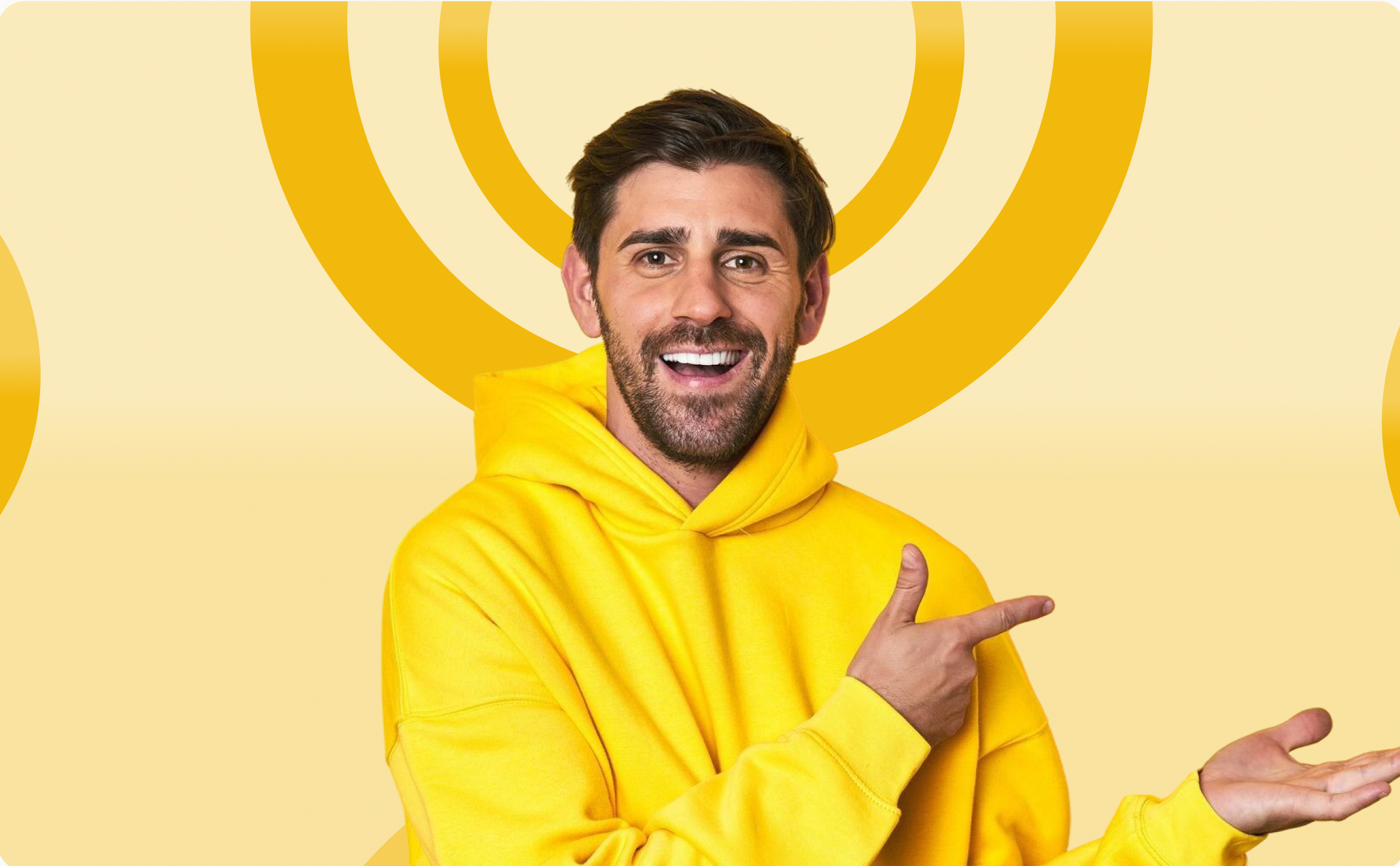 Man in yellow hoodie pointing